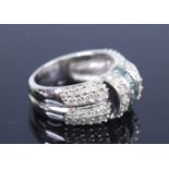 An 18ct white gold diamond multi-stone dress ring, featuring a centre band of five Princess cut