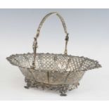 A George III openwork silver swing-handled pedestal bread basket, of elliptical form, the sides