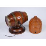 A 19th century treen cotton dispenser in the form of a brass coopered walnut barrel, the right end