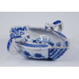 A Liverpool blue and white delftware double ended sauceboat, circa 1760, the press moulded body
