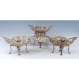 An Edwardian openwork silver and silver plate epergne set, comprising eight pieces being a silver-