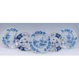 A matched set of three English blue and white delftware plates, 18th century, each decorated with