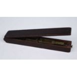 A late George III mahogany guinea balance, the hinged lid revelaing a folding brass scale with