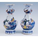 A pair of Delft polychrome vases, probably 19th century, each of lobed form, the garlic neck above a