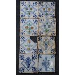 A matched set of four Dutch polychrome tiles, 17th century, each decorated with a flower within a