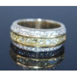 A yellow metal fancy yellow diamond three-row half hoop eternity ring, featuring a central band of