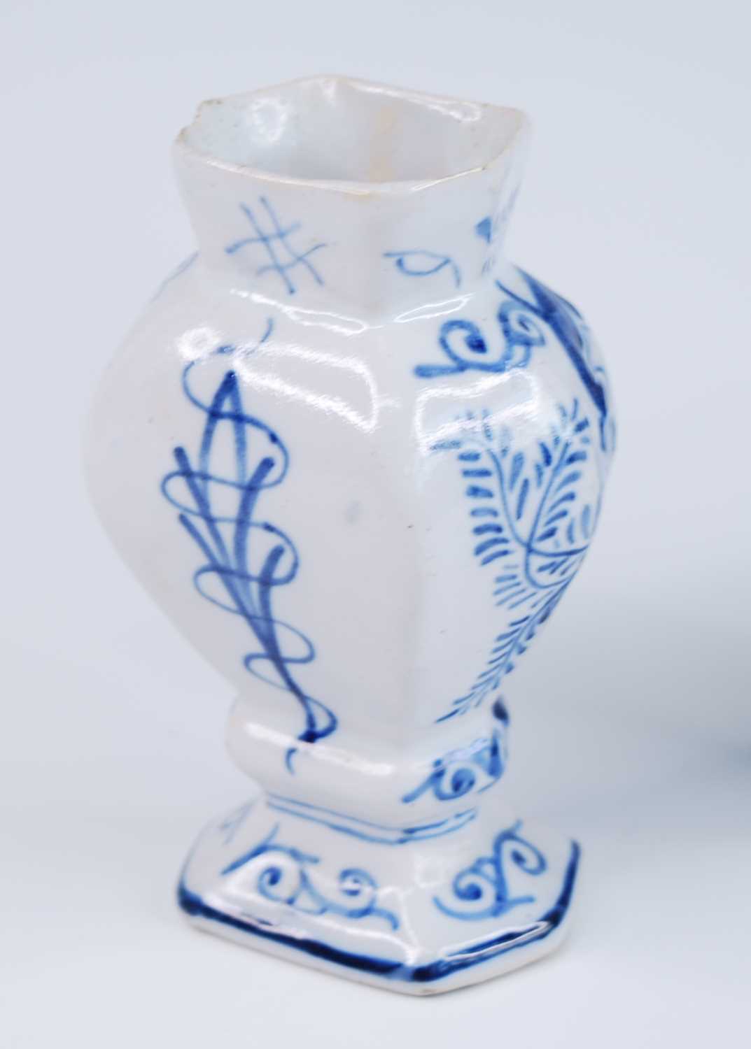 A Delft blue and white vase, 18th century, the garlic neck above a globular body, decorated with - Image 4 of 9