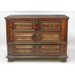 A late 17th century continental fruitwood chest, in two sections, having three flights of