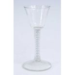 A wine glass, the round funnel bowl above a double series opaque twist stem, h.15cm