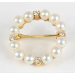 An 18ct yellow gold Mikimoto pearl and diamond circular brooch, comprising twelve 4.3mm Akoya