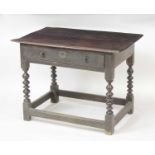 A circa 1700 joined oak single drawer side table, having a two-plank top and raised on bobbin turned