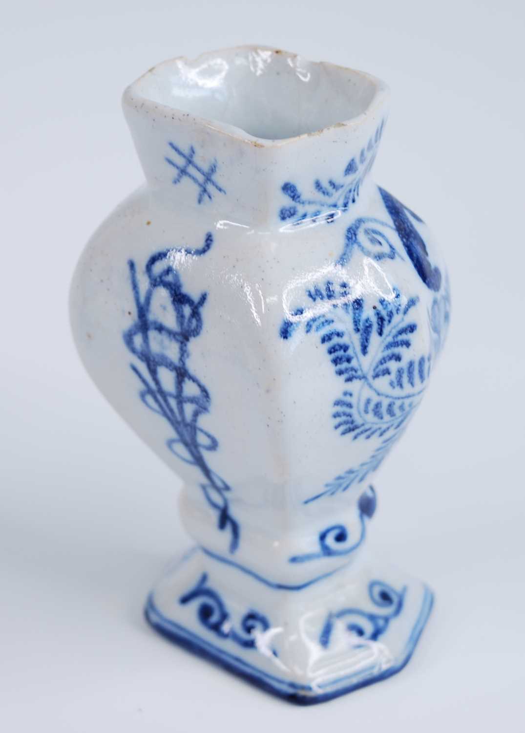 A Delft blue and white vase, 18th century, the garlic neck above a globular body, decorated with - Image 8 of 9