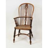 A Victorian elm seat ash & yew wood Windsor chair, having a pierced vase splat back dish seat over a