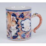 A Chinese porcelain tankard, 18th century, decorated with a cartouche depicting an interior scene