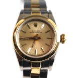 A lady's bi-metal Rolex oyster perpetual automatic wrist watch with round champagne index dial and