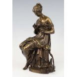 A late 19th century bronze model of a seated robed woman with quiver of arrows by her feet, unsigned