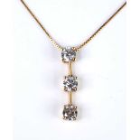 A yellow metal diamond articulated bar pendant, featuring three round brilliant cut diamonds in claw