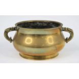 A Chinese gilt bronze censer, having applied handles, the base with Xuande six character mark within