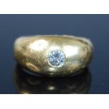 An 18ct yellow gold diamond set signet ring, having a round brilliant cut diamond flush set within a