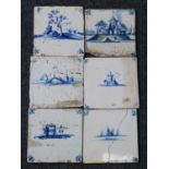 A matched set of six Dutch blue and white tiles, 18th century, each depicting a landscape within