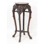 A Chinese carved rosewood jardiniere stand, of octagonal baluster form with marble inset top and