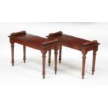 A pair of Victorian style mahogany window seats, each having turned ends and on ring turned tapering