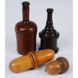 A 19th century turned yew-wood spice container of mallet shape, the screw cap opening to reveal an