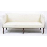 An early 19th century mahogany framed settee, the whole reupholstered in a cream silk damask (with