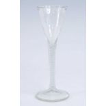 A wine glass, the trumpet bowl above a mixed air and opaque twist stem, h.19cm