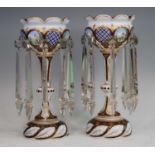 A pair of Bohemian blue and white overlaid glass table lustres, 19th century, each enamel