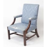 A 19th century mahogany framed Gainsborough armchair, the whole reupholstered in a blue silk