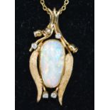 A yellow metal tulip shaped opal and diamond pendant, featuring a 17.35 x 8.75 x 5.7mm precious opal