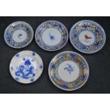 A collection of five Spanish polychrome glazed earthenware dishes, to include Manises examples, 19th