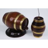 A 19th century treen cotton dispenser, in the form of a brass coopered walnut barrel with screw cap,