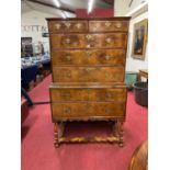 An early 18th century walnut chest on stand, the upper section having two short and three long