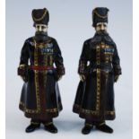After Faberge, a pair of cold painted bronze figures of cossacks, modelled as Kudinov and