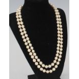 A two-row pearl necklace, featuring fifty-two and fifty-four 8.2 to 8.7mm baroque cultured pearls
