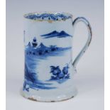 An English blue and white delftware tankard, probably London, circa 1760, decorated with a pagoda