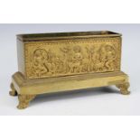 A late 19th century gilt bronze jardiniere, the frieze cast in relief with three cherubs, animals,