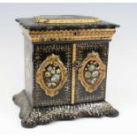 A Victorian papier-mache and mother of pearl inlaid table-top writing cabinet in the manner