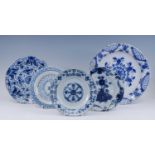 A Delft blue and white charger, 18th century, decorated with geometric motifs, dia.34cm, together