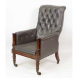 A William IV mahogany library chair, the whole upholstered in a buttonback grey leatherette, on