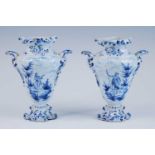 A pair of Delft blue and white vases, late 17th/18th century, each of wrythen form, flanked by C-