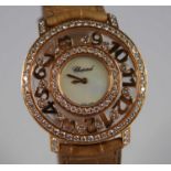 A lady's Chopard 18ct gold 'Happy Diamonds Happy Time' wristwatch, having a signed mother of pearl