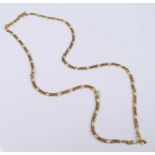 A yellow metal filed figaro link neck chain, having integral clasp and figure of eight safety catch,