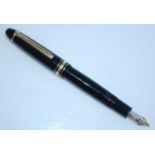 A Montblanc Meisterstück No.146 fountain pen, in black resin with gold trim, having a medium No.4810