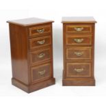A pair of walnut and figured walnut bedside chests, each having a cross and feather banded top above