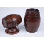 A Victorian lignum vitae cotton dispenser in the form of a barrel, having ring turned decoration