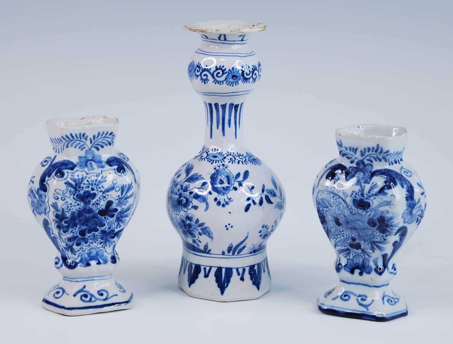 A Delft blue and white vase, 18th century, the garlic neck above a globular body, decorated with