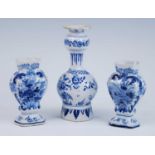 A Delft blue and white vase, 18th century, the garlic neck above a globular body, decorated with